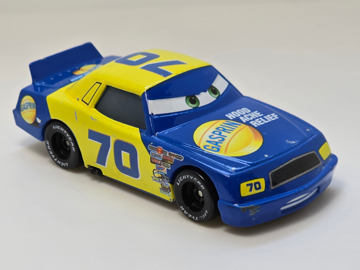DISNEY PIXAR CARS - FLOYD MULVIHILL #70 GASPIRIN - " HOOD ACHE RELIEF" - PRE OWNED